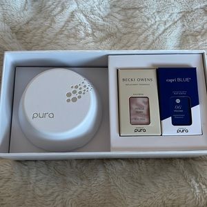 Pura diffuser brand new with two scents that have never been opened!